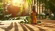 © Nibir - Amber glass bottle of essential oil with green leaves on a wooden table in sunlight