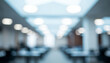 © Vhagar - Abstract view of an office or institutional hallway with cool lighting tones, bright ceiling fixtures, and repetitive architecture fading into the distance.