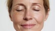 © Viral - Close-up of a woman's face showing a before and after comparison of skin with and without wrinkles, highlighting the effects of aging and skincare.