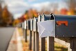 © Ascents - Row of mailboxes with letter in suburban neighborhood