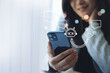 © tippapatt - Digital AI chatbot coversation assistant, artificial intelligence technology, Happy young Asian woman using mobile smartphone with AI chatbot for online information, internet bot automatic answering