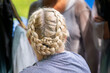 © Kaja - French Braid Hairstyle on Woman. Portrait of the back of a young girl wearing French braids in her hair. French braid close up.