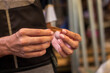 © Rokonuzzamnan - A man holds spices in his hand in the market