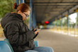 © tan4ikk - Girl Waiting For Bus At Station In Autumn