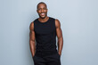 © SHALENA - Smiling African sporty man with hands on hips, ready for gym or workout, isolated on transparent background