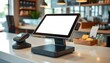 © Husen - Modern POS system with blank screen sits on a cafe counter.