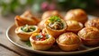© Viktor - An assortment of delicious mini tartlets and spring rolls are displayed on a plate. These small, colorful bites feature savory fillings like egg and vegetables, perfect for parties or catering events.