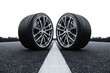 © shiva - High performance alloy car wheels with modern sport tires on asphalt road center line, automotive engineering detail, racing vehicle parts, symmetrical composition, precision design, transportation te