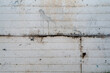 © AlessandraRC - A weathered metal surface shows signs of rust and grime, with horizontal lines creating a subtle pattern across the panel. The surface appears worn, with various marks and spots adding character to it