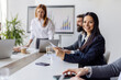 © Dusan Petkovic - Selective focus on smiling businesswoman with tablet sitting at boardroom with tablet and smiling at camera.