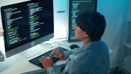 Software developer using keyboard debugging code programming task monitor screen system application development focus logic