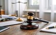 © Stocker - Gavel and scales of justice on a wooden desk with legal documents and pen symbolizing law and order