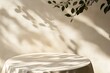 © MdRaselMahmud - A round table covered in white cloth with leaf shadows
