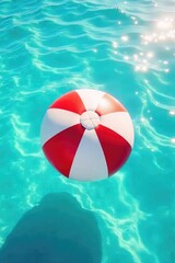 Wall Mural - A bright red beach ball floats gently on a turquoise ocean, sun shining on the water Perfect for summer vacation, travel, and leisure themes Enjoy the carefree vibe , tropical, beach