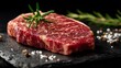 © PrettyVectors - Premium marbled wagyu beef steak on dark slate