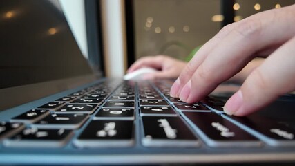 Wall Mural - close-up horizontal view of hand typing on laptop at coffee shop on holidays. concept of working out