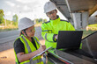 © reewungjunerr - Two engineers discuss about work at the site of large bridge under construction,Management consulting people discussion with engineers about the progress and construction planning of highway