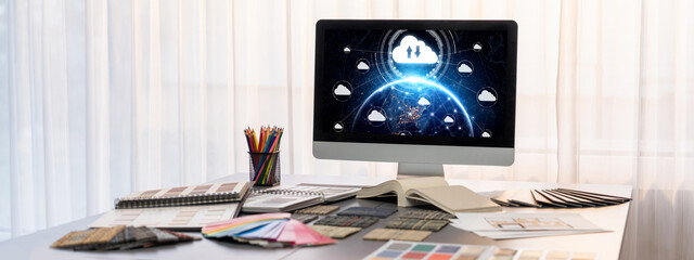 Interior designer workspace table and architecture software on laptop screen with mood board materials and colorful swatch color for color selection. Modern interior design office. Insight