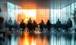 © bright - Group of business people sitting around a long conference table in a modern glass-walled meeting room with a bright orange sunset outside, creating a professional and reflective atmosphere
