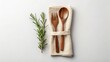 © SR Stock - Wooden utensils wrapped in cloth with rosemary sprig