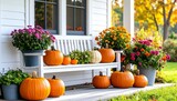 Autumnal porch display with pumpkins and mums