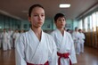 © Iftikhar alam - Kids training in karatedo at a local dojo with focus on discipline and teamwork during evening practice session