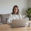 © Rheo - Focused Young Woman Working Remotely in a Cozy Home Office