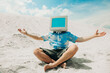 © VISTA by Westend61 - Person with CRT monitor head relaxing on sand dune in summer