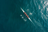 A team of four rowers rowing a racing shell in synchronization on open water.