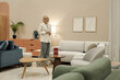 © DragonImages - Caucasian woman standing in modern furniture store examining showroom display, holding hands together while looking at various seating options and decorative elements