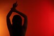 © New Africa - Silhouette of woman posing on red gradient background, back view. Space for text