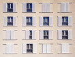 © AmazingAerialAgency - Aerial view of a symmetrical facade with white framed windows and partially closed shutters creating a rhythmic pattern of light and shadow, Split, Split-Dalmatia County, Croatia.