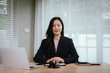 © Kieng - Attractive young lawyer in office Business woman and lawyers discussing contract papers with brass scale on wooden desk in office. Law, legal services, advice, Justice and real estate concept.
