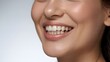 © dang - Close-up of a bright, cheerful smile showcasing perfect white teeth and smooth skin