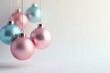 © jiratip - Delicate pastel-colored glass Christmas ball ornaments suspended from a ceiling against a pure white backdrop , aesthetic, christmas balls hanging, pastel glass ornaments