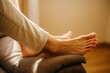 © Andrei Antipov - Bare feet relaxing on sofa in warm sunlight, minimalist home setting, AI generated