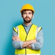 © Ouzhan - Construction worker with his arms crossed and wearing a hard hat