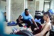 © Marko Geber - Personal trainer coaching senior woman on weightlifting exercise at the gym