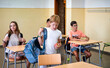 © C&A - Elementary school students entering classroom, unpacking backpacks and preparing for the school day