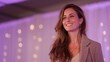 © vlntn - Confident Woman Smiling at Event Reception