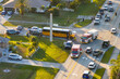 © bilanol - Car and school bus accident on highway road in Florida. Emergency services personnel helping victims of vehicle crash on city street in USA