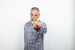 © Wirestock - Serious senior man making stop sign with index finger