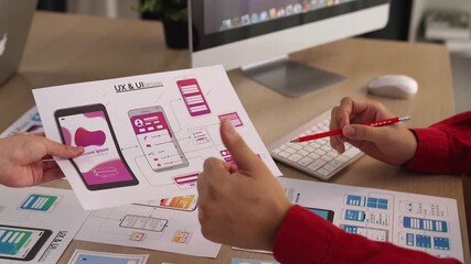 Wall Mural - excellent startup company employee presenting user interface prototype for mobile application to sma