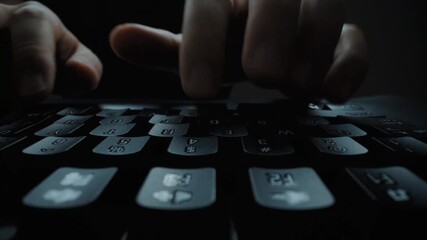 Wall Mural - close-up man typing on computer keyboard with hands and fingers. macro soft focus dolly shot. comput