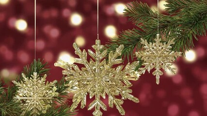 Wall Mural - Three shiny gold snowflakes are hanging from a tree branch, creating a festive and joyful atmosphere. The snowflakes are suspended in the air, adding a touch of magic to the scene