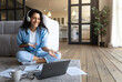 © Prostock-studio - Portrait of cheerful Caucasian woman in headphones making video call, using laptop computer from home, free space. Happy millennial female having virtual online meeting or conference