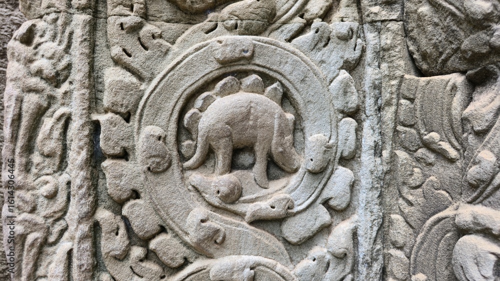 Tample Animal Ta Prohm, Cambodia - 3 July 2025. Detailed carving on a temple pillar ...