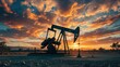 © Lavanya - Industrial oil field scenery at sunset with pumpjack and vibrant sky