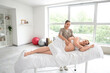 © Pixel-Shot - Young pregnant woman getting massage in clinic