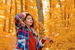 © Volodymyr - Portrait of woman walking outdoors in autumn day. Woman on autumn background. Woman with autumn leaves. Girl in autumn fall leaves park. Girl on autumnal fall background. Foliage, falling leaves.